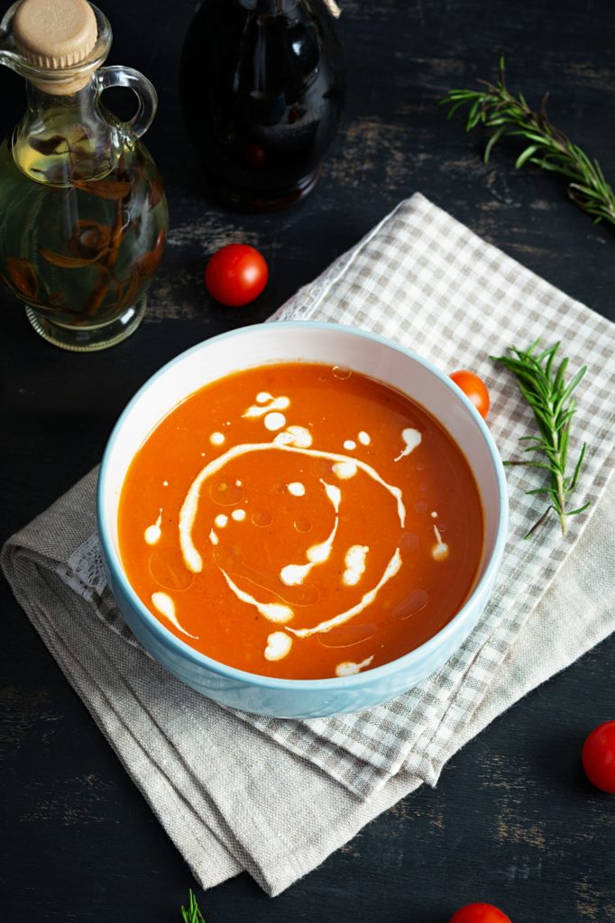Сream soup of tomatoes and pepper. Hot tomato soup in bowl